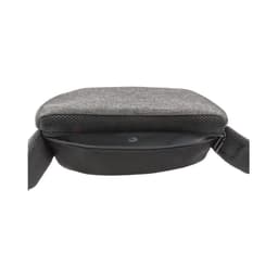 A grey anti-theft sling bag with a zippered compartment and adjustable strap, featuring a textured surface.