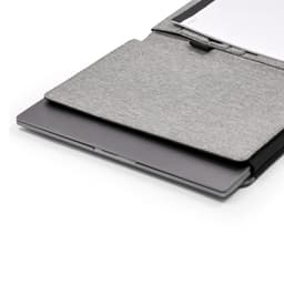 A grey business folio featuring a laptop compartment and space for documents. It has a sleek, minimalist design.