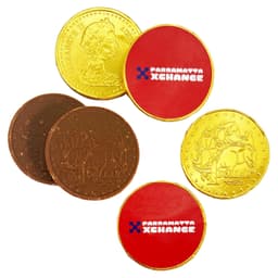 A selection of chocolate coins in gold and brown, featuring round shapes with a branded logo on one side.