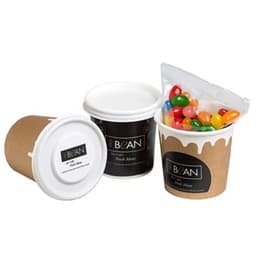 A coffee cup in brown cardboard with a white lid, containing a bag of colourful jelly beans. It features a logo.