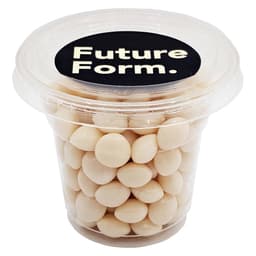 A clear tub filled with white chewy mints, featuring a black lid with a logo.