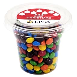 A clear tub filled with colourful Mini M&Ms, featuring blue, green, yellow, red, and brown candies.