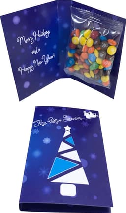 A gift card with a 25g bag of colourful M&M chocolates inside a festive blue card. The card features a Christmas tree design.