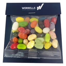 A clear bag contains a colourful assortment of JELLY BELLY jelly beans in various shapes and sizes, packaged with a logo.