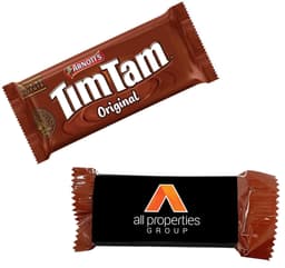 A Tim Tam biscuit in a brown wrapper with branding, displayed alongside a brown sleeve featuring a logo.
