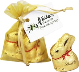 A gold organza bag containing two 10g Lindt chocolate bunnies, tied with ribbon and a branded tag.
