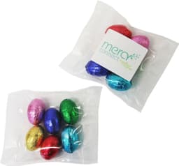 A bag containing six mini solid Easter eggs in various colours: pink, blue, green, red, and gold.