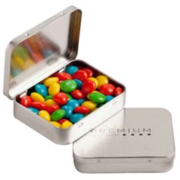 A rectangular tin with a silver finish, filled with vibrant chewy fruit candies in red, yellow, green, and blue.