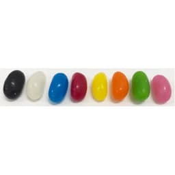 Jelly beans in various colours, including black, white, blue, red, yellow, green, orange, and pink, displayed in a row.