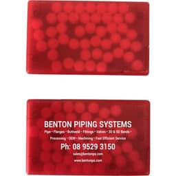 A red mint card featuring a textured surface, with one side displaying a logo and contact information.