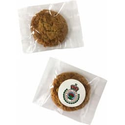 Mixed biscuits individually wrapped in clear cellophane, featuring a light brown colour and a logo on one pack.
