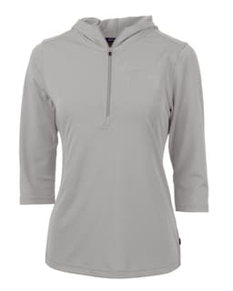 A light grey half-zip jacket for ladies, featuring a hood and three-quarter sleeves. It has a logo on it.