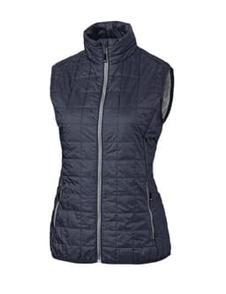 A dark grey puffer vest with a zip front and high collar, featuring two side pockets and a branding logo.
