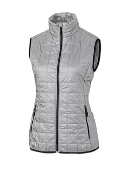 A light grey ladies' puffer vest with a high collar and zippered pockets, featuring a logo on the front.