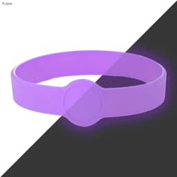 A purple silicone wristband featuring a circular design element and branding.