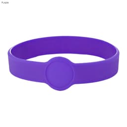 A purple silicone wristband featuring a circular design element and a logo.