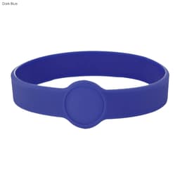 A dark blue silicone wristband featuring a circular design element. It includes a logo or branding.