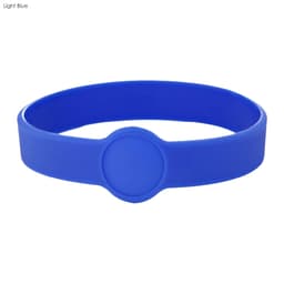A light blue silicone wristband featuring a circular design. The band includes a logo or branding element.