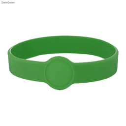 A dark green silicone wristband featuring a circular design element and a smooth finish.