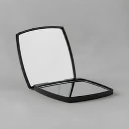 A compact mirror with a sleek black exterior, featuring two reflective surfaces inside. It has branding visible.