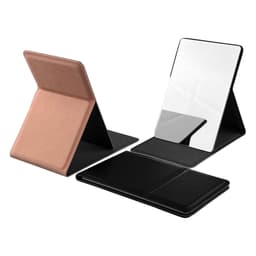 A compact mirror with a rose gold and black case, featuring a folding design and reflective surface.
