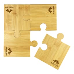 A bamboo coaster set featuring four puzzle-shaped pieces, coloured in natural bamboo tones, with a logo design.