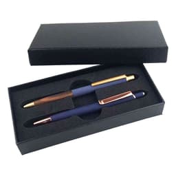 A gift set featuring two metal pens in a black box, one with a wooden finish and gold accents, and one in navy blue with rose gold accents.