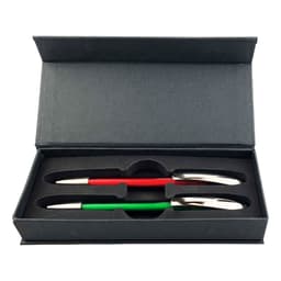 A gift box containing two plastic pens, one red and one green, with silver accents. The box has a sleek design and a logo.