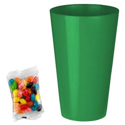 A bright green party cup next to a bag of colourful jelly beans in various shades. The bag is transparent.