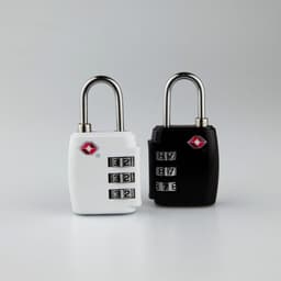 Two TSA locks are displayed: one white and one black, both featuring a combination dial and a logo.