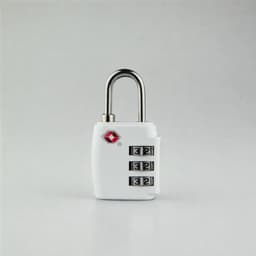 A white portable TSA luggage lock with a silver shackle and a combination dial. It features a small logo on the body.