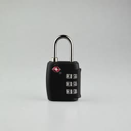 A portable black luggage TSA lock with a silver shackle and three rotating dials for the combination.