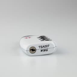 A portable luggage TSA lock in white with a keyhole, featuring a black and silver design and a logo.
