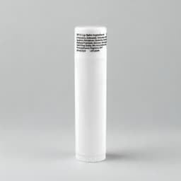 A white lip balm tube with a rounded cap, featuring ingredient information on the label.