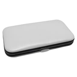 A white and black manicure set case featuring a smooth exterior and a silver clasp.