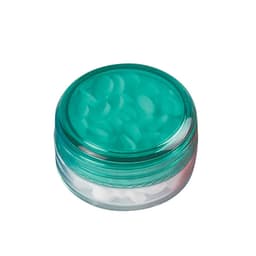 A screw lid mint jar with a clear base and a teal lid, containing small white sugar-free lollies.