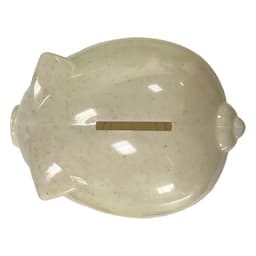 A light beige piggy bank with a slot on top and a rounded body, made from wheat straw material.