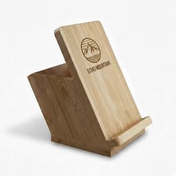 A bamboo mobile stand and pen holder with an angled design and a logo on the front.