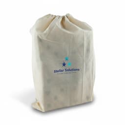 A drawstring bag in cream featuring a logo. The bag appears to contain wooden yard dice inside.