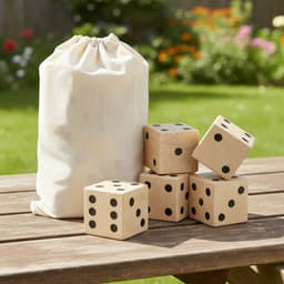 A wooden yard dice set with five large dice and a drawstring canvas bag, set on a wooden table outdoors.