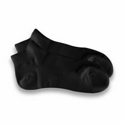 A pair of black ankle grip socks with textured detailing and a logo on one sock.