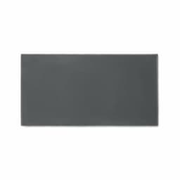 A rectangular grey mat with a smooth texture, featuring a simple design and a subtle branding logo.