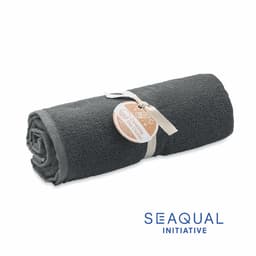 A rolled grey towel with a tag, featuring a logo of the Seaqual Initiative.
