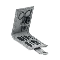 A grey felt nail kit featuring scissors, a nail file, and other grooming tools in a portable case.