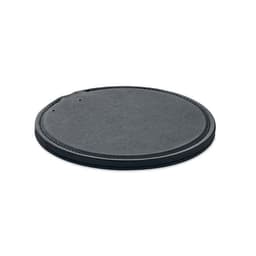 A round, black leather coaster with a stitched edge and a small hole for hanging.