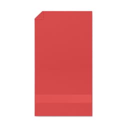 A red product with a smooth texture and a folded top corner, featuring a horizontal band at the bottom.