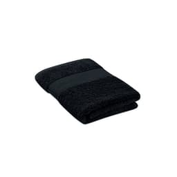 A black folded towel with a textured band. The towel features a simple, elegant design.