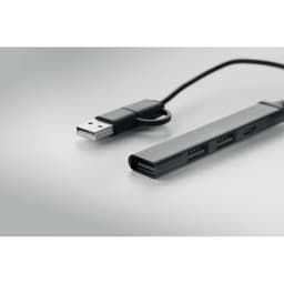 A charging hub with multiple USB ports in black, connected to a USB cable with a plug on one end.