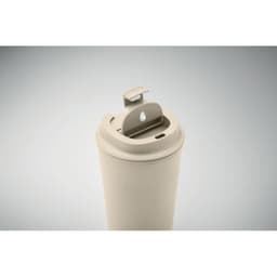 A drink bottle in a soft beige colour with a flip-top lid and built-in spout, featuring a logo on the side.