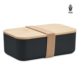 A black lunchbox with a wooden lid, secured with a beige elastic strap. It features a logo on one side.
